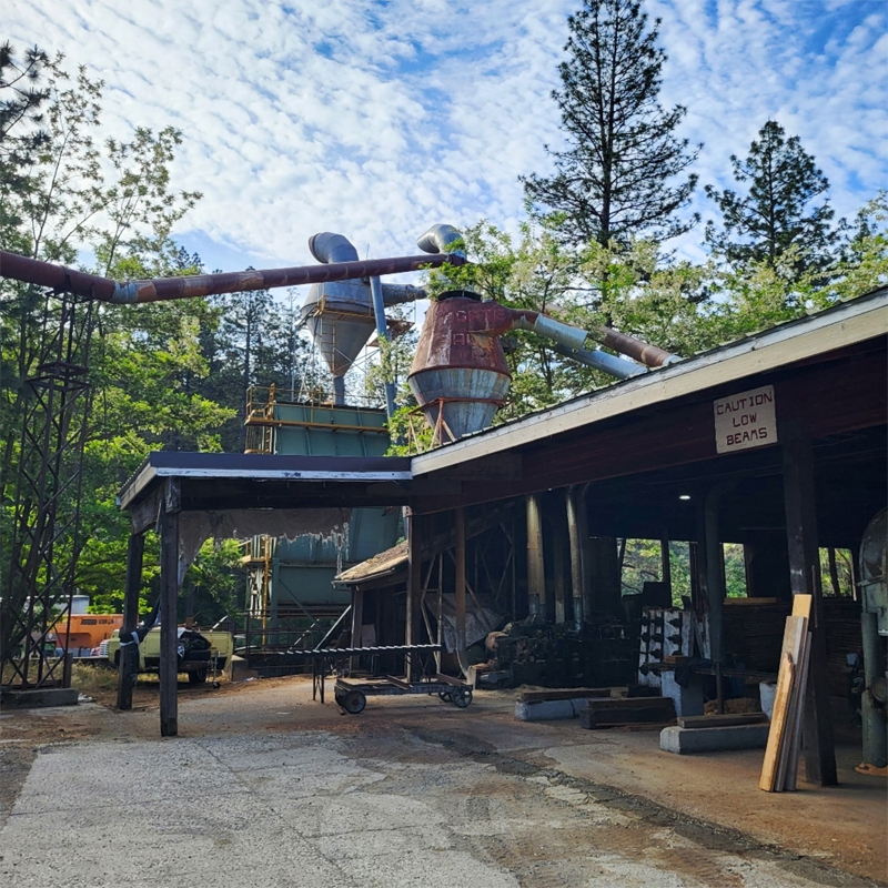 Sierra Mountain Millwork building and photo of mill equipment with trees in the background